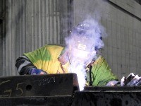 A welder works in the production plant of the Syd Varanger iron ore mine near the arctic city of Kirkenes, northern Norway on June 3, 2013. AFP PHOTO / PIERRE-HENRY DESHAYES        (Photo credit should read Pierre-Henry DESHAYES/AFP/Getty Images)