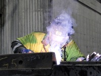 A welder works in the production plant of the Syd Varanger iron ore mine near the arctic city of Kirkenes, northern Norway on June 3, 2013. AFP PHOTO / PIERRE-HENRY DESHAYES        (Photo credit should read Pierre-Henry DESHAYES/AFP/Getty Images)